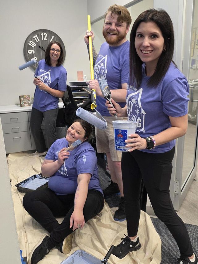 Volunteers working together on a group project at the clinic.